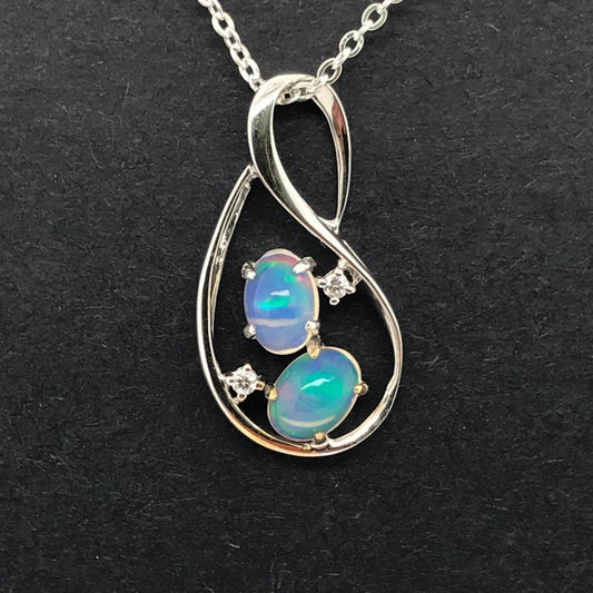 14K WG SOLID WHITE OPAL AND DIAMOND PENDANT